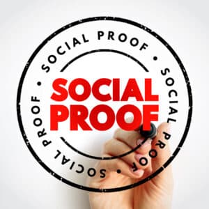 Seal that reads 'Social Proof' being drawn by a hand holding a marker.